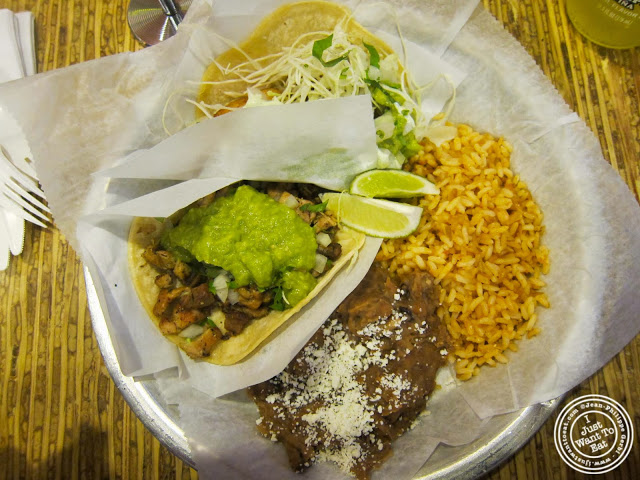 image of pollo assado (charbroiled chicken) and pescado (fish) tacos at Pinche Taqueria in NYC, New York