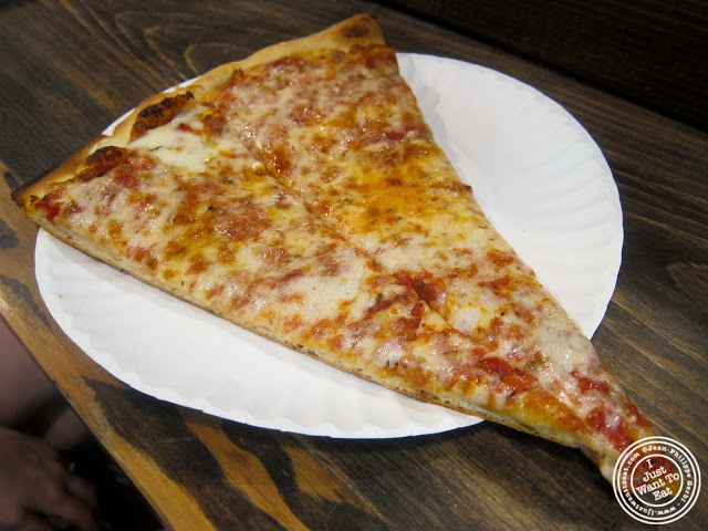 image of plain slice at Stromboli Pizza in NYC, New York