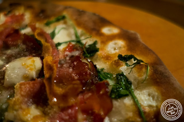 image of Speck and arugula pizza at Capizzi  in Hell's Kitchen, NYC, New York