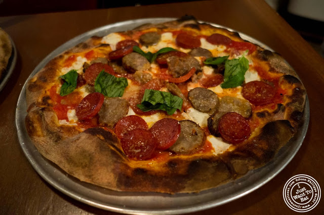 image of pepperoni and sausage pizza at Capizzi  in Hell's Kitchen, NYC, New York