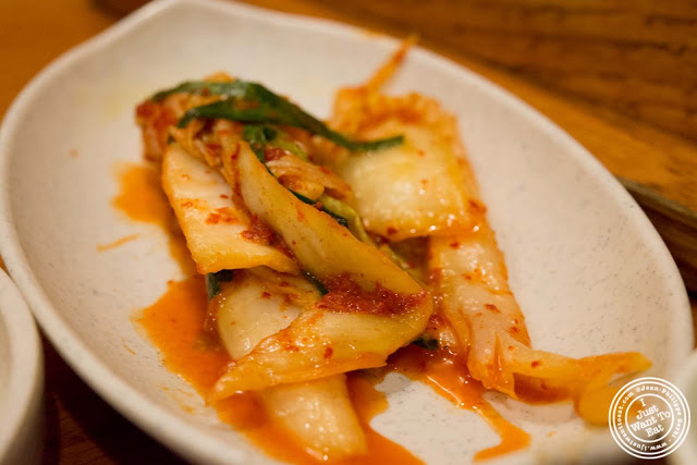 image of kimchi at Kunjip Korean restaurant  in NYC, New York