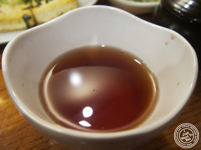 image of cinnamon tea at Kunjip Korean restaurant  in NYC, New York