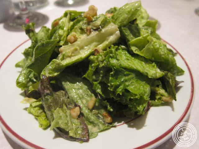 image of green salad and walnuts at Le Relais de Venise in NYC, New York