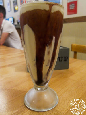 Image of black and white milkshake at Island Burgers and Shakes in Hell's Kitchen, NYC, New York