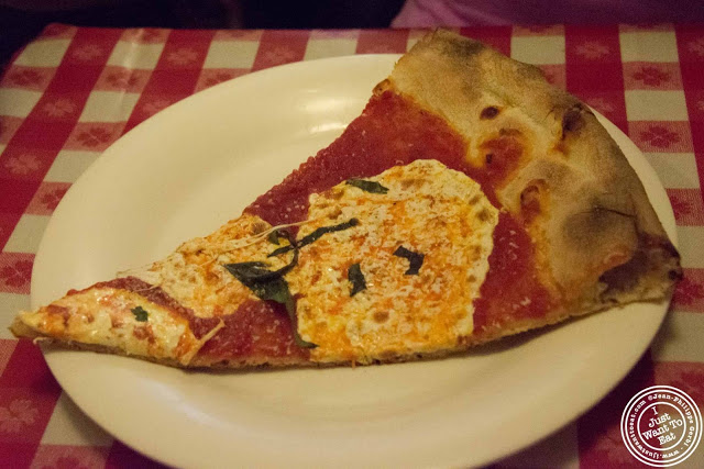 image of pizza slice at Lombardi's pizza with  Scott's pizza tours in NYC, New York