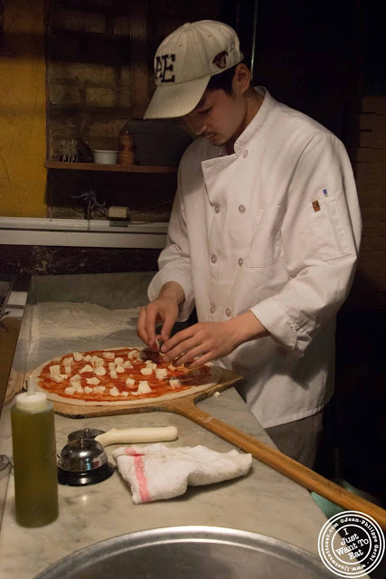 image of pizza making at Luzzo's with Scott's pizza tours in NYC, New York