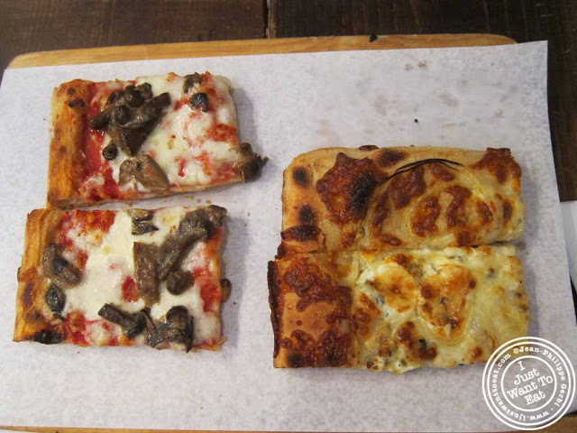 Image of mushroom pizza and the Cipola Y Gorgonzola (onions and gorgonzola) pizza at Pizza Roma in NYC, New York