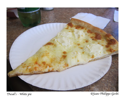 Image of White pizza slice at Dusal's Italian Restaurant in Freehold, NJ